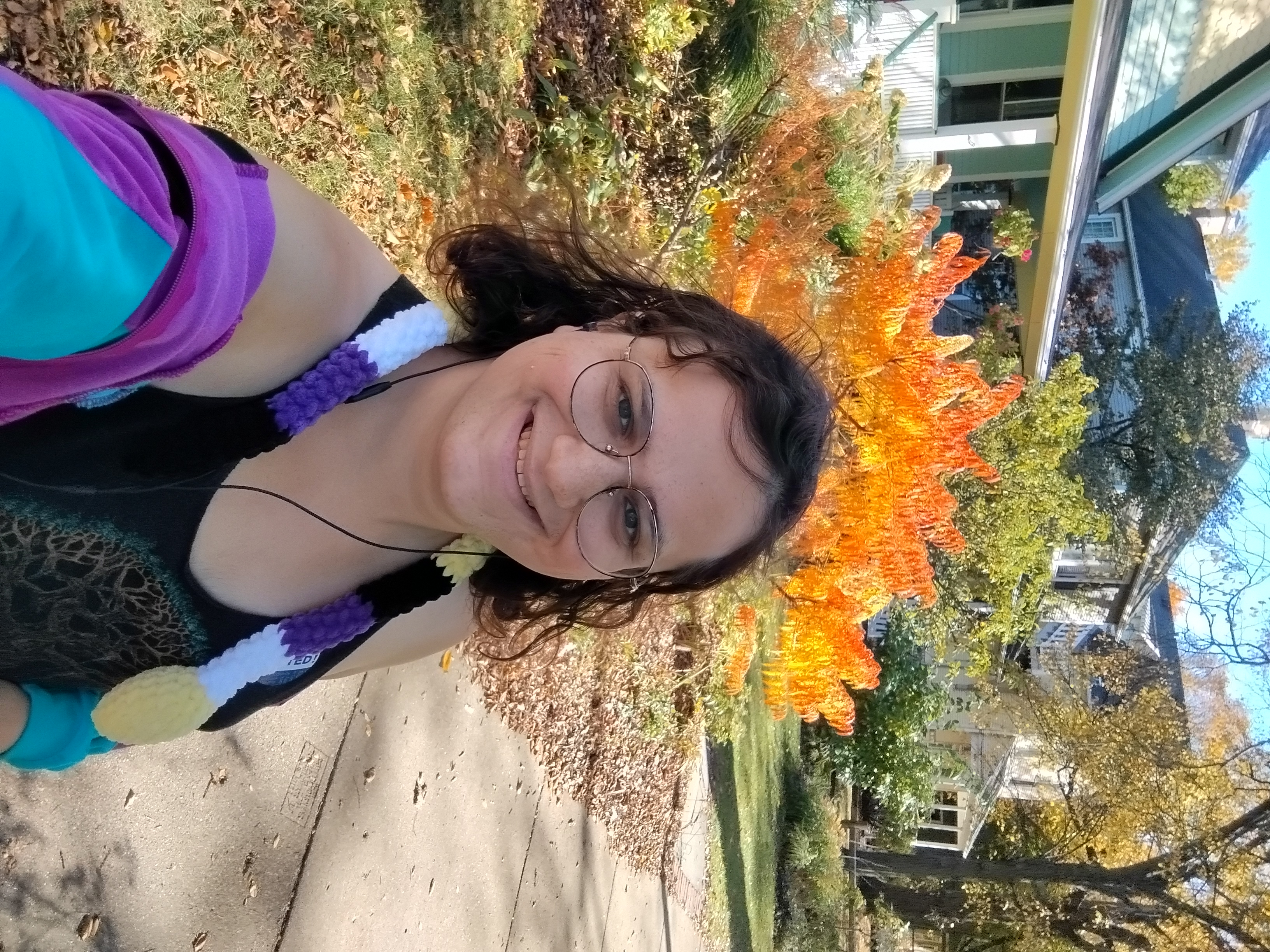 Me in front of a yellow-orange tree