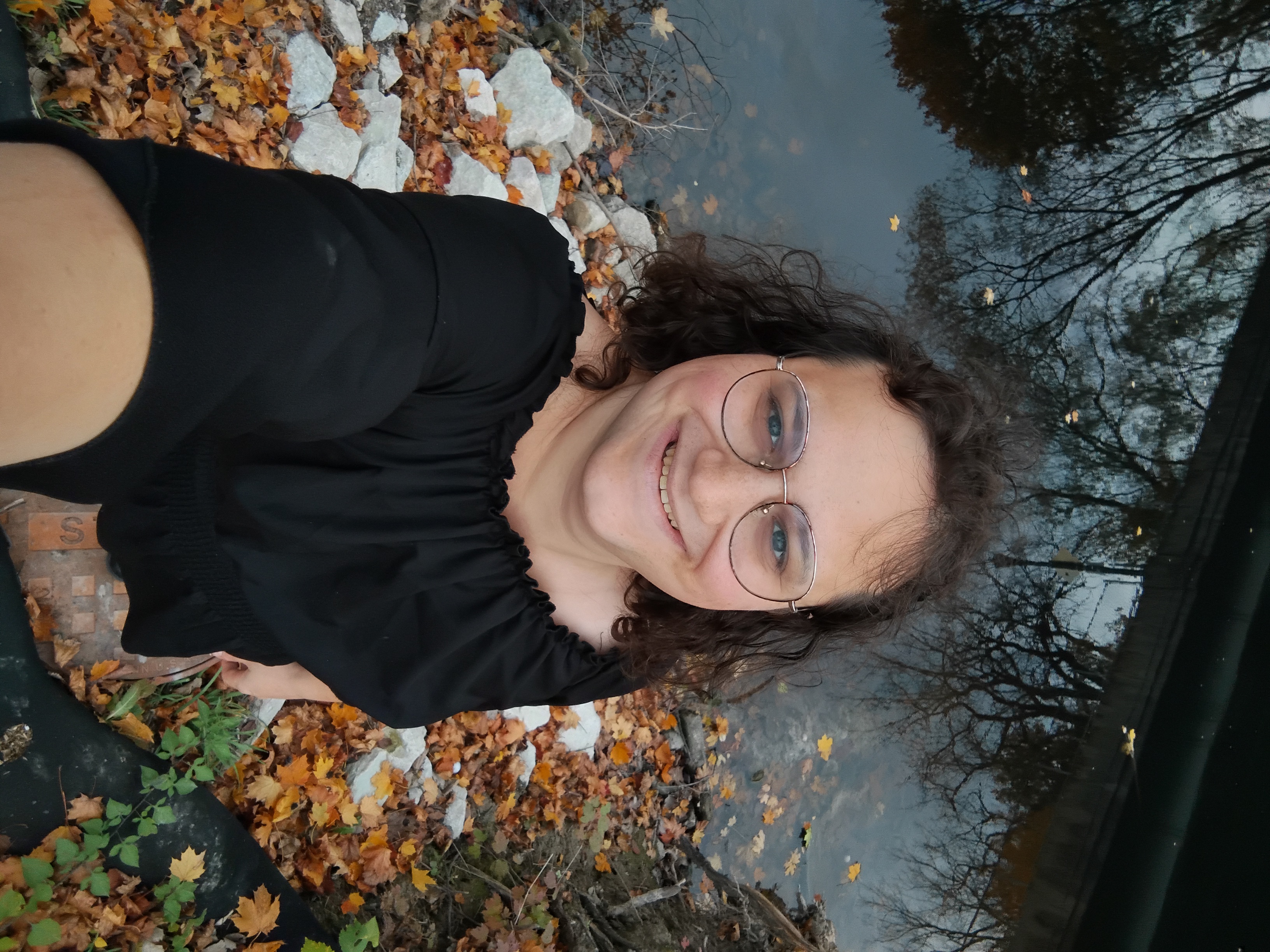 Me from above showing a different part of the river with some white rocks on the ground below me.