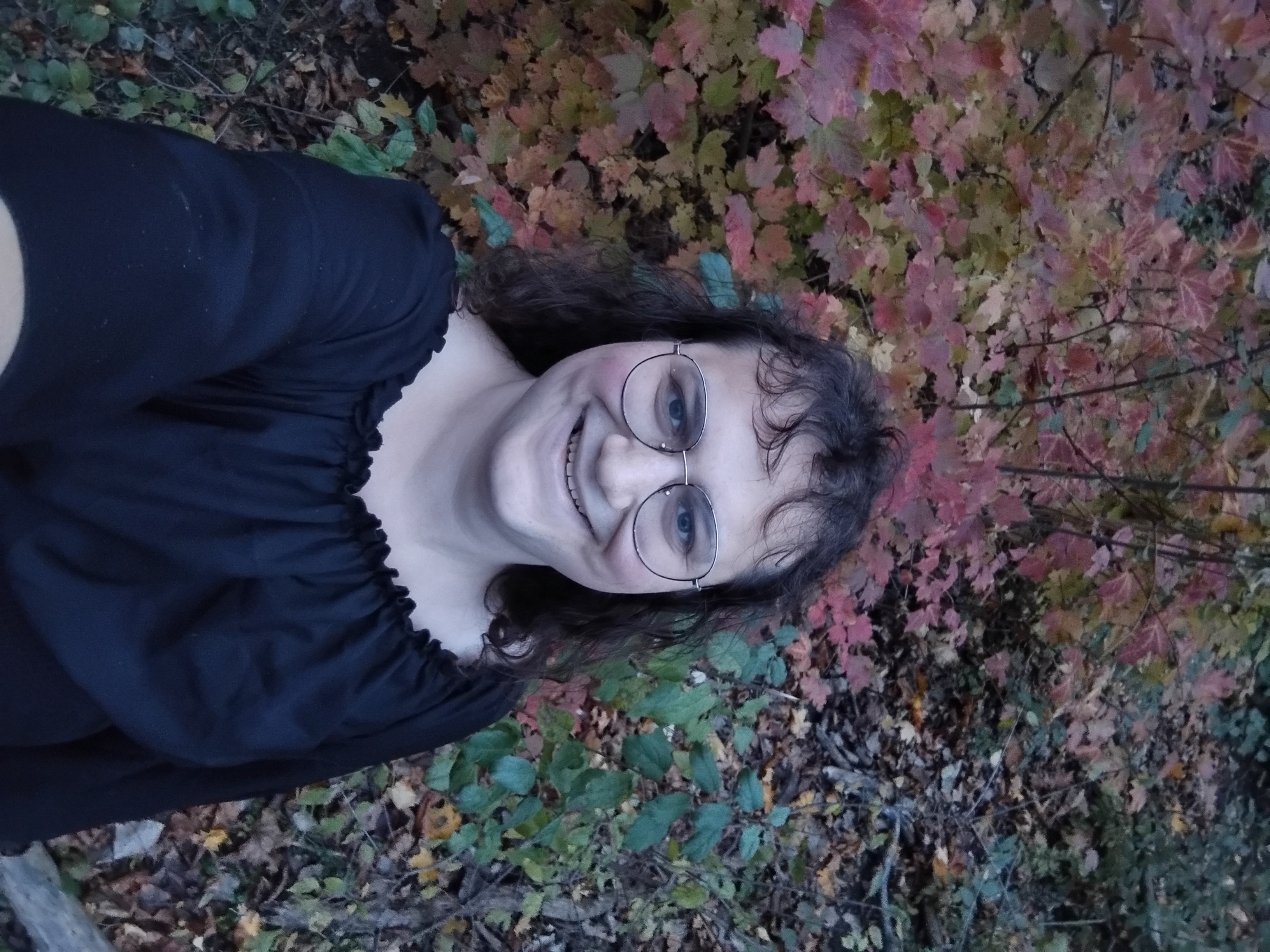 Me in front of a bush with red-yellow leaves