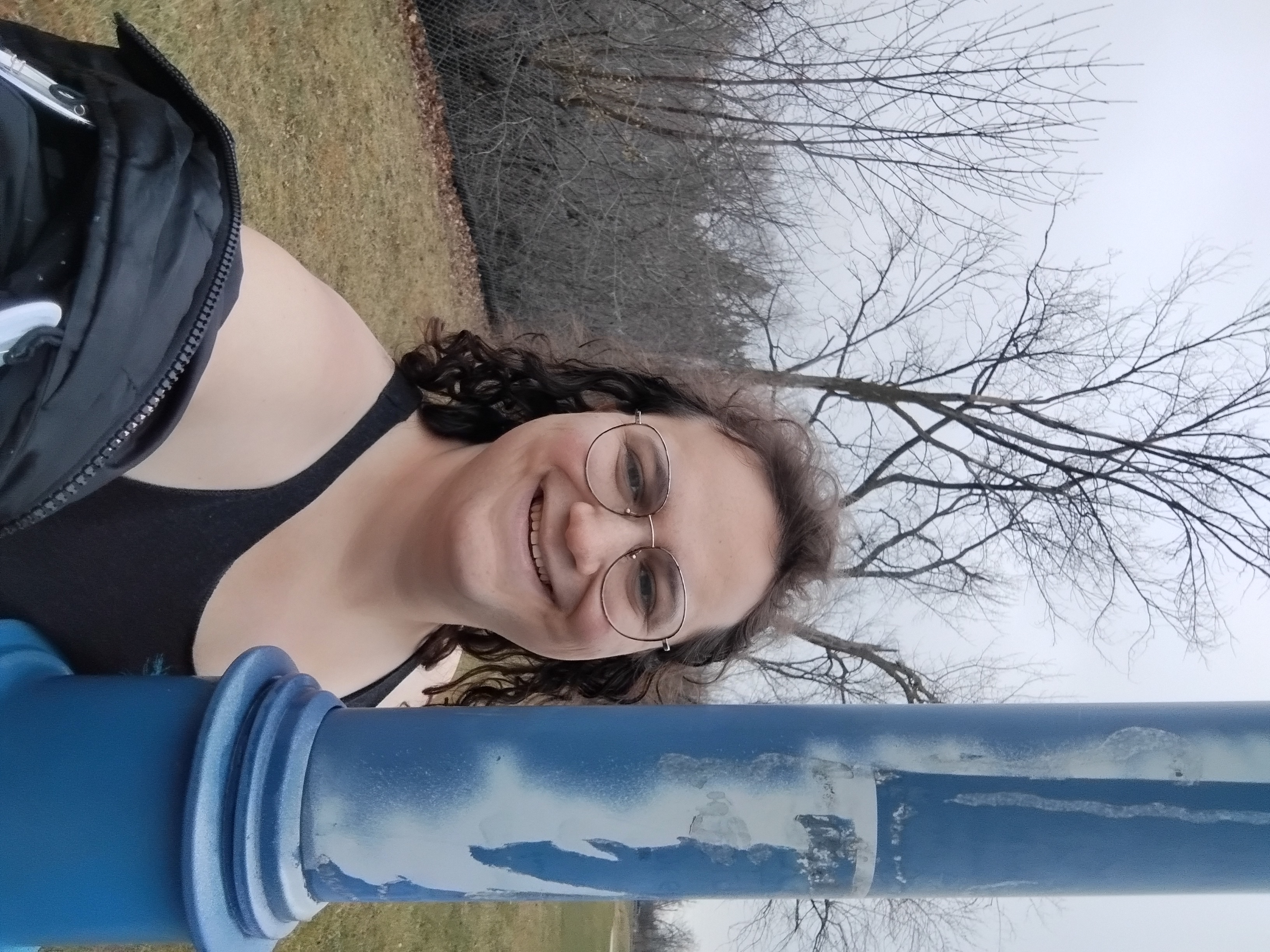 A closer photo next to a blue-white pole.